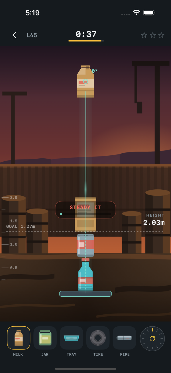 Junk Stack gameplay — a tower of recycling above the goal line